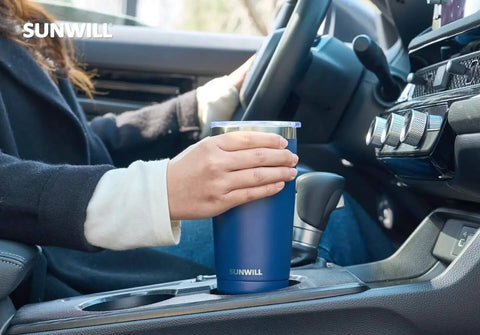 Person holding 20 Oz Travel Coffee Tumbler Insulated Stainless Steel Cup With Lid in car, navy blue powder coated, double wall vacuum