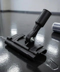 Sturdy Floor Coating Roller Clamp Accessory With Metal Handle Grip Holder Attachment For Tight Control And Stable Base, Ideal For Workshop Use, Industrial Tasks, And DIY Repairs on black floor