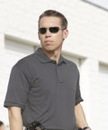 Mens Short Sleeve Uniform Polo In Charcoal Black Moisture Wicking Polyester Pique Fabric That Keeps You Cool Under Pressure Built For Real Crews Running The Daily Grind Without Getting Sweaty Or Wrinkled Out on a security personnel.