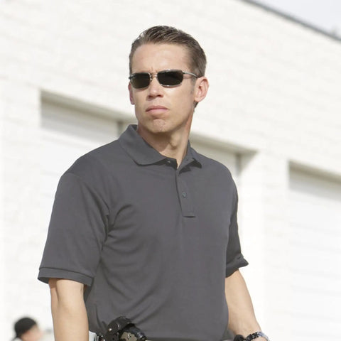 Mens Short Sleeve Uniform Polo In Charcoal Black Moisture Wicking Polyester Pique Fabric That Keeps You Cool Under Pressure Built For Real Crews Running The Daily Grind Without Getting Sweaty Or Wrinkled Out on a security personnel.