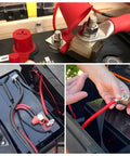 Set of heavy duty waterproof fuse blocks with red cables and connectors, showing installation on a truck battery.