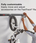 Person adjusting bicycle on Garage Wall Storage Kit With FastTrack Rails Hooks Shelves And Cabinets Built To Last Heavy Duty Steel