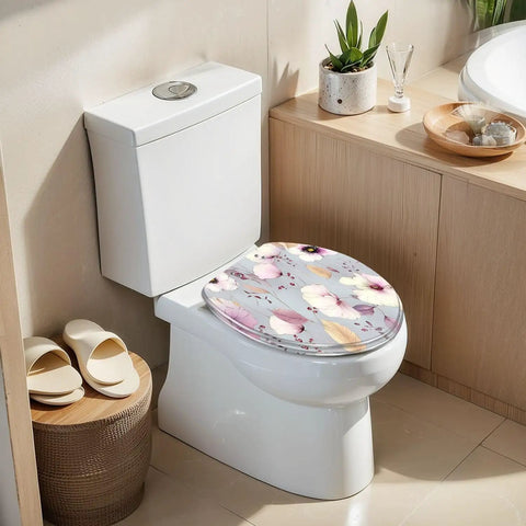 Soft Close Elongated Toilet Seat for Bathroom featuring floral design on elongated toilet in modern bathroom setting.