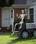 5.9-Foot Life-Size Poseable Skeleton For Halloween Decor on cart in front yard