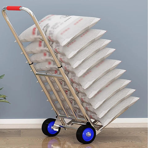 Hella Tough Folding Sack Truck With Solid Rubber Wheels And Rugged Utility Dolly Platform For Zero Sweat Heavy Moving Gear Hauling Up To Two Hundred Forty Two Pounds, loaded with stacked bags.