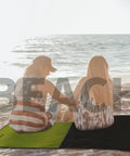 Couple on beach with Pocket Sized Picnic Blanket Waterproof And Sandproof Beach Mat For Festivals Hiking Travel And Outdoor Adventures
