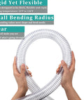 Hands holding Clear PVC Spiral Steel Reinforced Flexible Hose 1.5 Inch ID, 5 Feet Long, demonstrating flexibility and transparency.