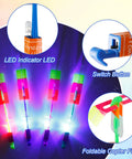 Close-up of 60 Pack LED Arrow Helicopter Slingshot Toys For Kids with illuminated LEDs, switch buttons, and foldable copter fins