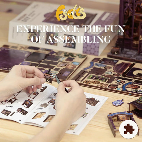 DIY Book Nook Kit For Beginners With The Astrology Bookshop Theme Miniature Scene On A Shelf Wooden Laser Cut Craft Kit hands assembling.