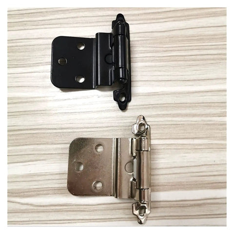 Side-by-side comparison of 3/8 inch overlay cabinet hinges in matte black and stainless steel finish on wood surface.
