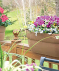 Railing Planter With Drainage Holes For Decks And Balconies 24 Inch Weatherproof Resin Planter Made From Polyethylene Plastic In White Fits Wood Or Metal Rails Ranging 1.25 To 3.875 Inches Wide installed on a wooden deck
