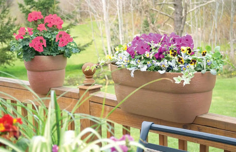 Railing Planter With Drainage Holes For Decks And Balconies 24 Inch Weatherproof Resin Planter Made From Polyethylene Plastic In White Fits Wood Or Metal Rails Ranging 1.25 To 3.875 Inches Wide installed on a wooden deck