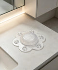 2 Pack Hair Catcher Drain Cover - 5" Dome Shaped Soft PVC with 6 suction cups on a bathroom counter.