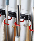Space Saving Stainless Steel Wall Mount Mop And Broom Holder With S Type Grippers, showing mop handles hanging in place