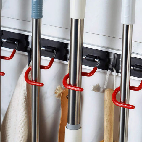 Space Saving Stainless Steel Wall Mount Mop And Broom Holder With S Type Grippers, showing mop handles hanging in place
