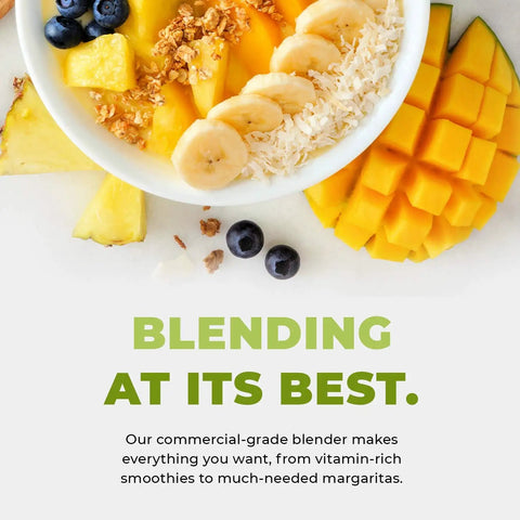 Bowl of assorted fruits and coconut flakes, highlighting the capabilities of Beast Pro Grade Countertop Blender With 3 HP 1800W Motor 64 Oz Jar.