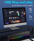 USB C Powered Desktop Speakers For PC Laptop Monitor And Tablet with RGB lights under computer monitor on a desk