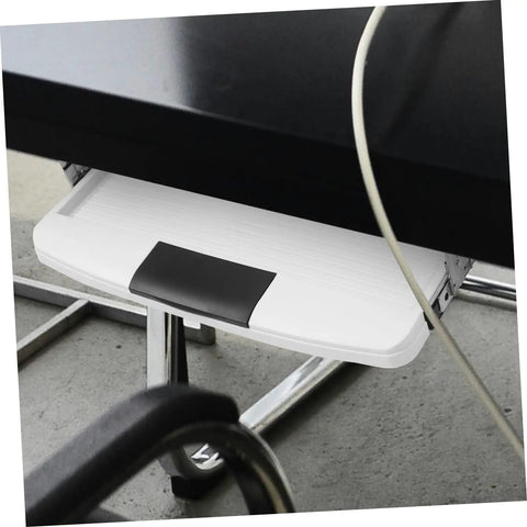 Under Desk Keyboard Tray With Slick Glide Mechanism And Ergonomic Wrist Rest For Smooth Typing Sessions, mounted under desk.