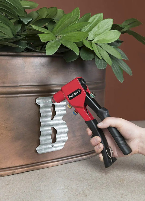 Heavy-Duty One-Handed Pop Rivet Gun For Quick Metal Fabric Leather And Auto Repairs Fits 3/32 1/8 5/32 And 3/16 Inch Blind Rivets used on metal planter.