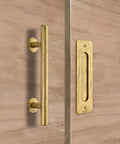12 Inch Gold Barn Door Handle Set With Round Pull, Flat Finger Pull, visible on wooden surface, part of sliding hardware kit.