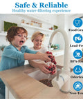 Children washing strawberries under filtered tap in kitchen, highlighting Combo Pack FX12P FX12M Or TFM-24 Water Filter Replacement Kit benefits