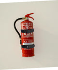 Red fire extinguisher mounted with black stretch fabric straps on a white wall, part of 20 Pack Black Stretch Fabric Fire Extinguisher Mounting Straps For Hose And Vehicle Use Easy Install Durable Fixing Straps Multipurpose Secure Mounts For Powder Fire Extinguishers In Cars Trucks And Home Garages