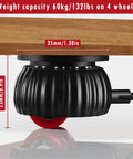 Close-up view of black 8 Pack Self Adhesive Caster Wheels With 360 Degree Swivel Mini Casters And Ball Bearings under a wooden table.