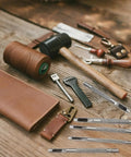 Six Piece Beefy Metal Hollow Hole Punch Kit For Leather Belt DIY Crafts 1.5mm To 4mm, tools and leather materials on wood surface