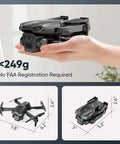 Hand holding a compact foldable 1080P camera drone, showing size dimensions under 249g, with no FAA registration required.