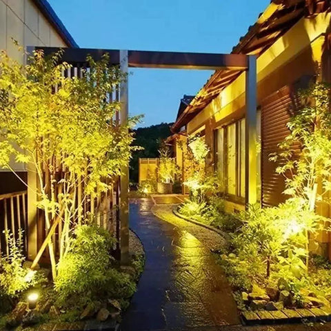 Garden path illuminated by Rugged Waterproof PAR36 LED Landscape Bulb Kit 9W 900LM 3000K Warm White 12V AC DC 4 Pack For Driveways Yards Off Road RVs And Tractors Energy Efficient Long Lasting Flood Lights Outdoor Use Weather Resistant