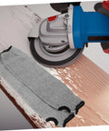 Heavy Duty Cut Resistant Arm Sleeves With Thumb Hole And No Sweat Breathable Design For Mechanics And Craftsmen lying beside a power tool.