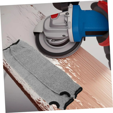 Heavy Duty Cut Resistant Arm Sleeves With Thumb Hole And No Sweat Breathable Design For Mechanics And Craftsmen lying beside a power tool.