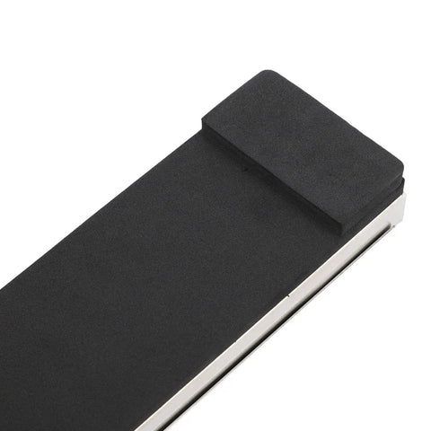 Close-up of Game Changing Golf Swing Training Aid With Gravity Pedal For Posture Correction And Hip Rotation black surface detail