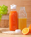 32 Oz Glass Milk And Juice Bottle Set With No Leak Airtight Screw Lid And Silicone Gasket, filled with orange and yellow juice