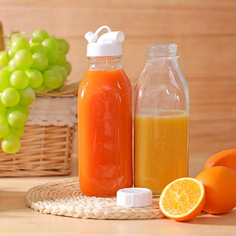 32 Oz Glass Milk And Juice Bottle Set With No Leak Airtight Screw Lid And Silicone Gasket, filled with orange and yellow juice
