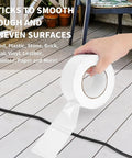 Person holding White Duct Tape Heavy Duty Waterproof 40 Yards By 2 Inches 9 Mils Thick With Strong Adhesive No Residue Easy Tear By Hand