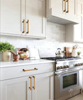 Antique Brass Cabinet Pulls 3 Inch 76mm Pack Of 10 Solid Zinc Alloy Kitchen Cabinet Handles installed on white cabinets