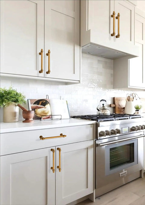 Antique Brass Cabinet Pulls 3 Inch 76mm Pack Of 10 Solid Zinc Alloy Kitchen Cabinet Handles installed on white cabinets