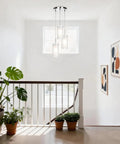 Modern Chrome Pendant Light With Clear Glass Cylinder And Frosted Inner Shade, 1 Light Hanging Fixture in a bright hallway
