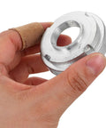 Hand holding part of 7 Pack Mini Dirt Bike Steering Shaft Bearings Kit for Off Road Rides, Beefed Up Performance Steering Bushings