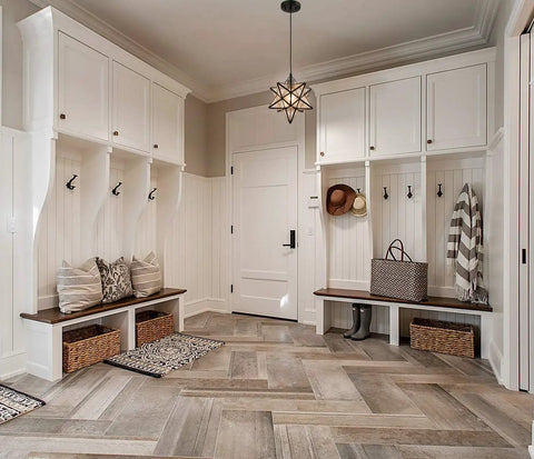Seeded Glass Moravian Star Pendant Light With Black Industrial Finish in cozy entryway with white cabinets and chevron floor