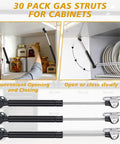 30 Pack 10 Inch Gas Struts For Cabinets And Doors With Soft Open Pneumatic Lift For RV Boat Hatch Furniture Lids 100N 22.5lb Heavy Duty Props Includes 29mm Mounts And 49 By 13 Mm Brackets installed in a cabinet