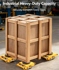 Badass Heavy Duty Moving Skates With 360 Degree Swivel And Non Slip Pads Rock Solid Carbon Steel Equipment Rollers For Factory And Warehouse Workloads Smooth Ride Load Movers Set Of Four under a large wooden crate.