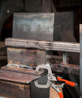 Heavy Duty C Clamps With Swivel Pads For Woodworking And Welding, securing metal pieces on workbench, durable carbon steel construction.