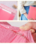Pink Bubble Mailers 100 Pack 12x18 And 4 Inch Thickened Self Sealing Shipping Envelopes close-up of texture and use