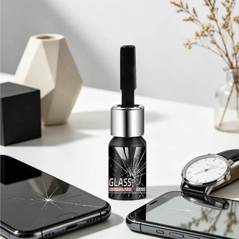 Glass Repair Liquid For Cracks And Scratches Portable Scratch Remover Quick Fix For Mobile Phones Watches Mirrors Windshields And Household Glassware Easy To Use bottle with a brush cap on a table with cracked phone screens and a watch.