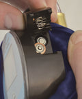 Close-up of the battery compartment on a 3.5 Inch Digital Tire Inflator With Hose, 0.1 Psi Precision For TPMS, Dual Battery Power For Long Life.