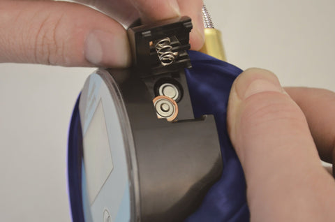 Close-up of the battery compartment on a 3.5 Inch Digital Tire Inflator With Hose, 0.1 Psi Precision For TPMS, Dual Battery Power For Long Life.