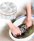 Two Pack Mini Portable Electric Clothes Washer With Usb Rechargeable Auto Cycle Compact Travel Laundry Cleaner For Delicates Socks And Quick Rinse Toss In Bag Nails The Clean Every Time, shown in use with a person washing a striped cloth.
