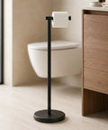 Zero Fuss Freestanding Toilet Paper Holder Stand In Classic Black With Heavy Duty Weighted Base For Smooth Easy Reach Setup.